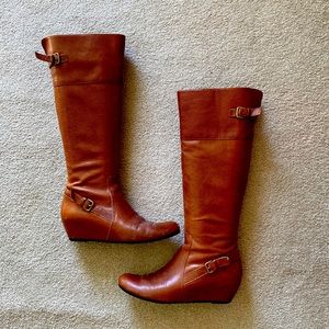 Steve Madden wedge boots with buckle accents